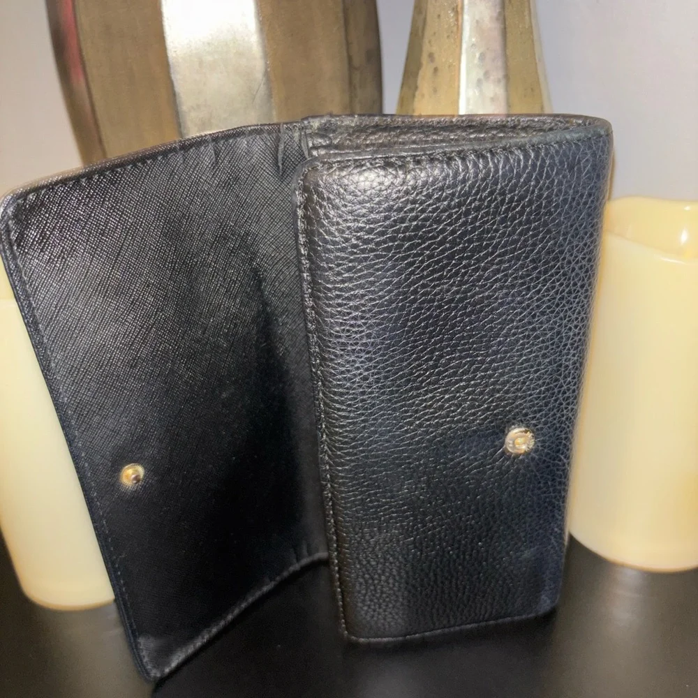 Michael Kors Fulton Large Flap Continental Wallet in black pebbled leather.